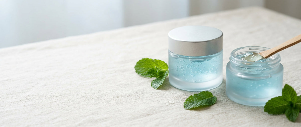 Frosted glass jar of clear gel with mint leaves — acne and breakouts
